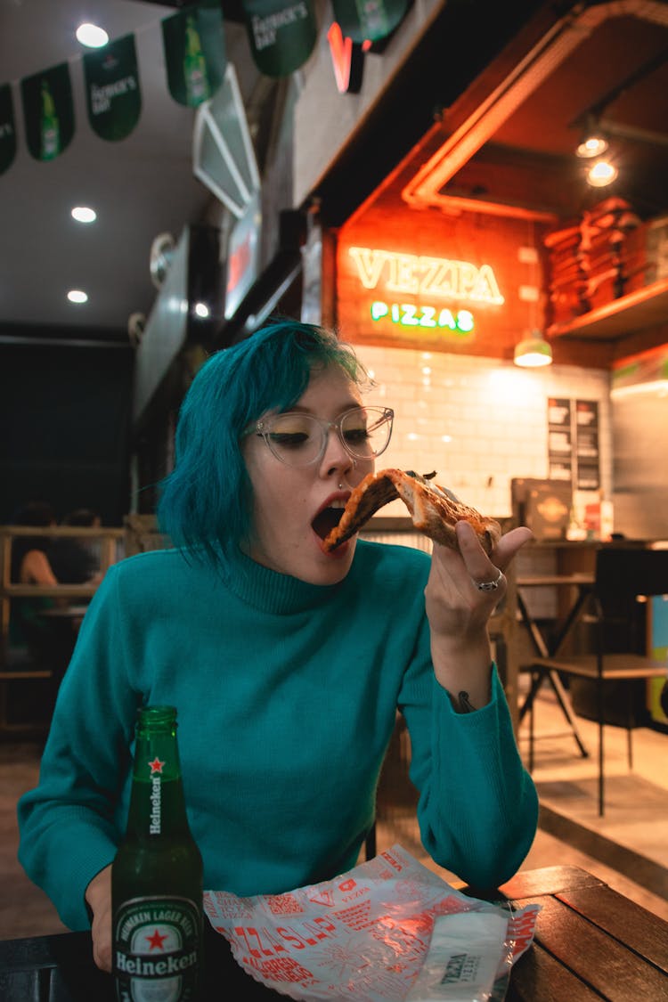 Woman Eating Pizza