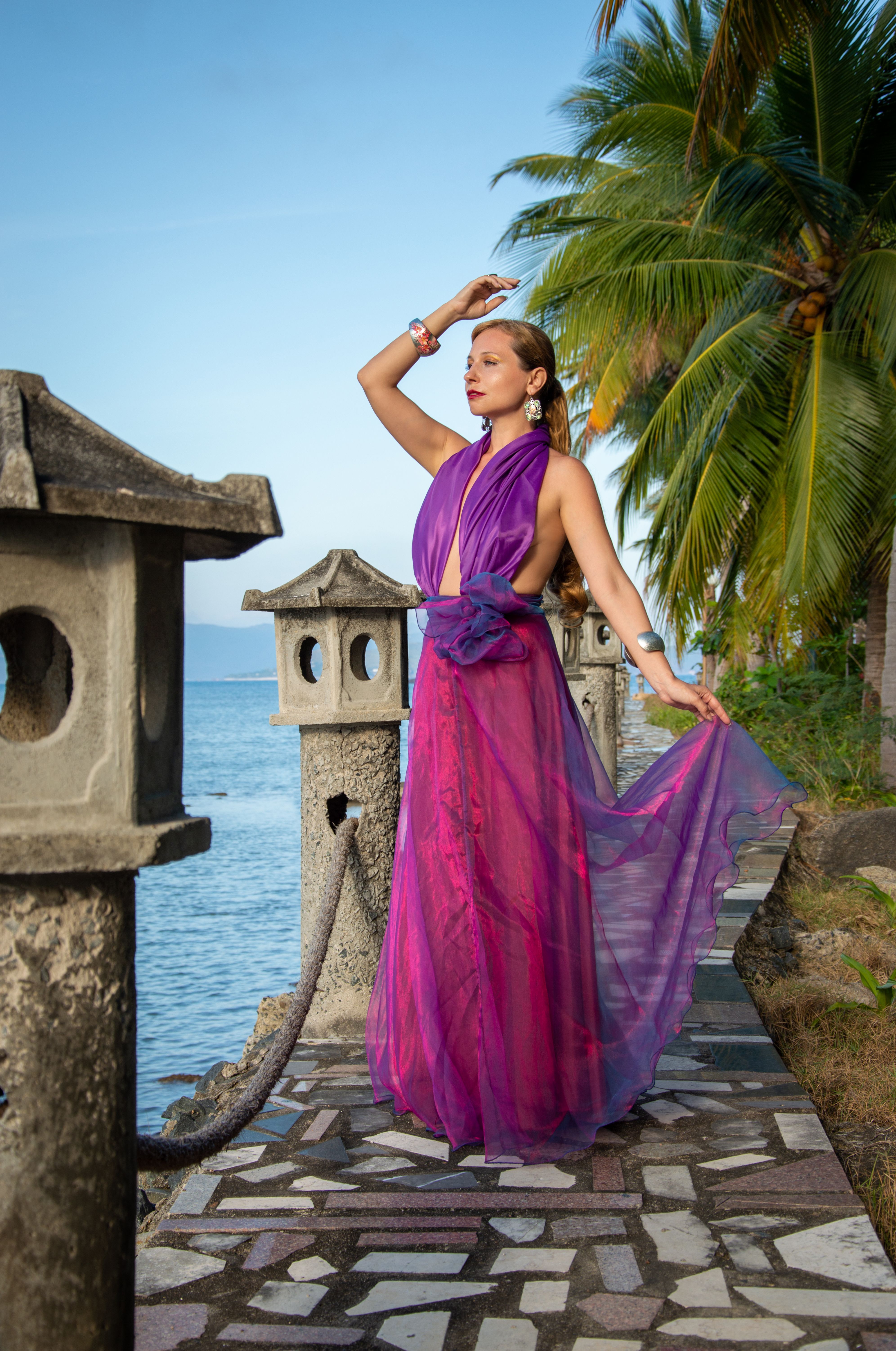 Portrait of a Stylish Blonde Woman in Purple Dress and Jewelry on the ...