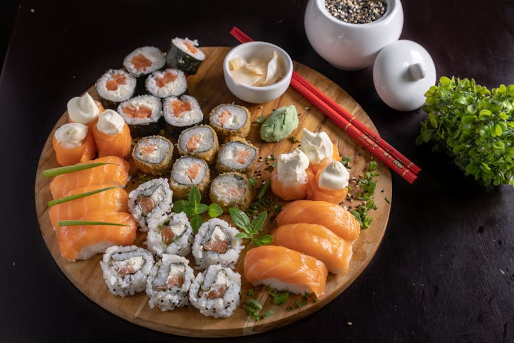 Japanese Sushi And Sashimi On Wooden Tray