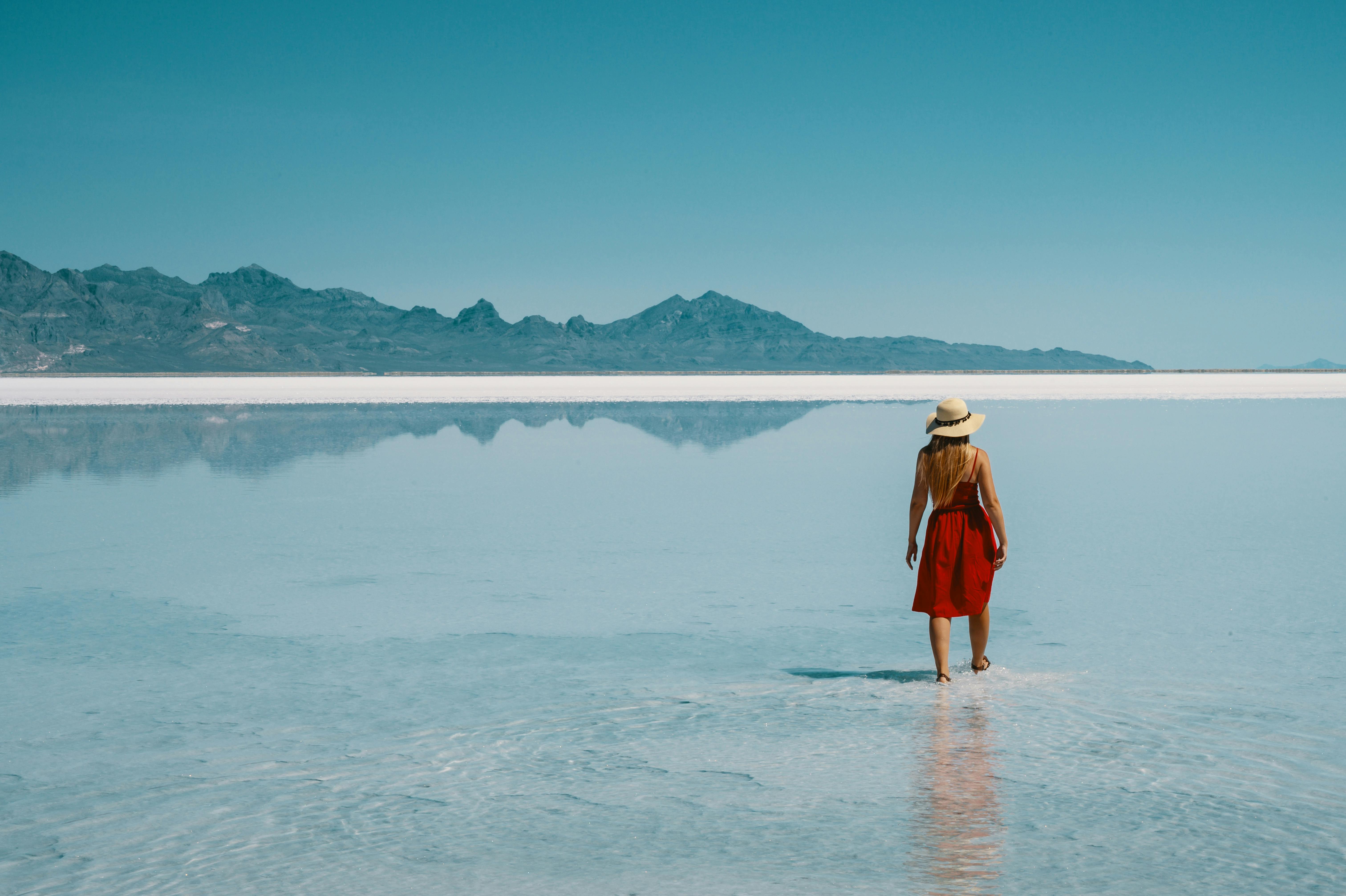 Woman Walking Along Low Tide Beach Free Stock Photo Woman Walking Along Low Tide Beach Free Stock Photo