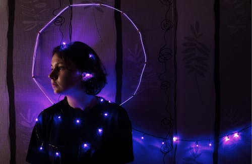 Free woman string lights Stock Photo