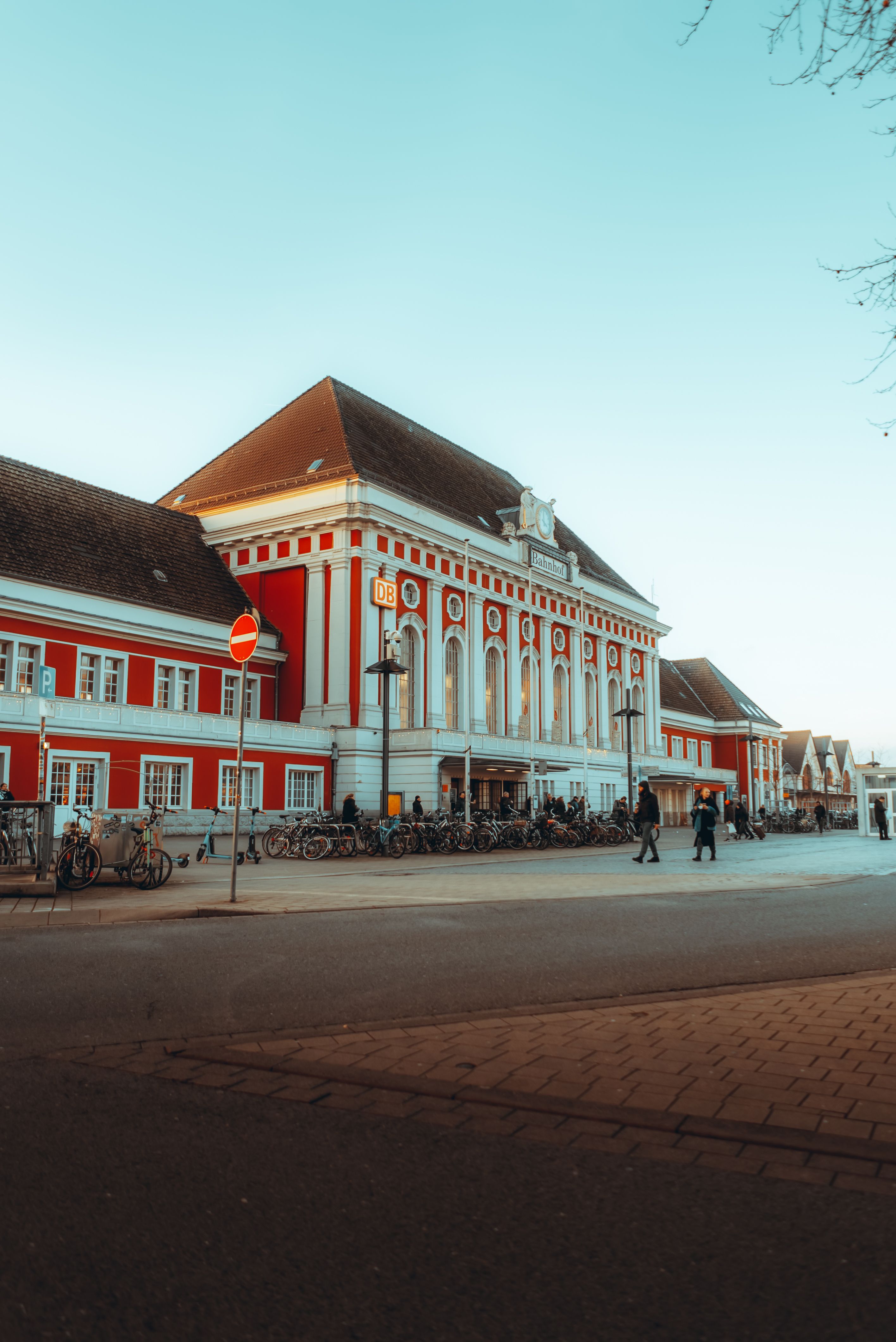 A red and white building with a clock tower · Free Stock Photo