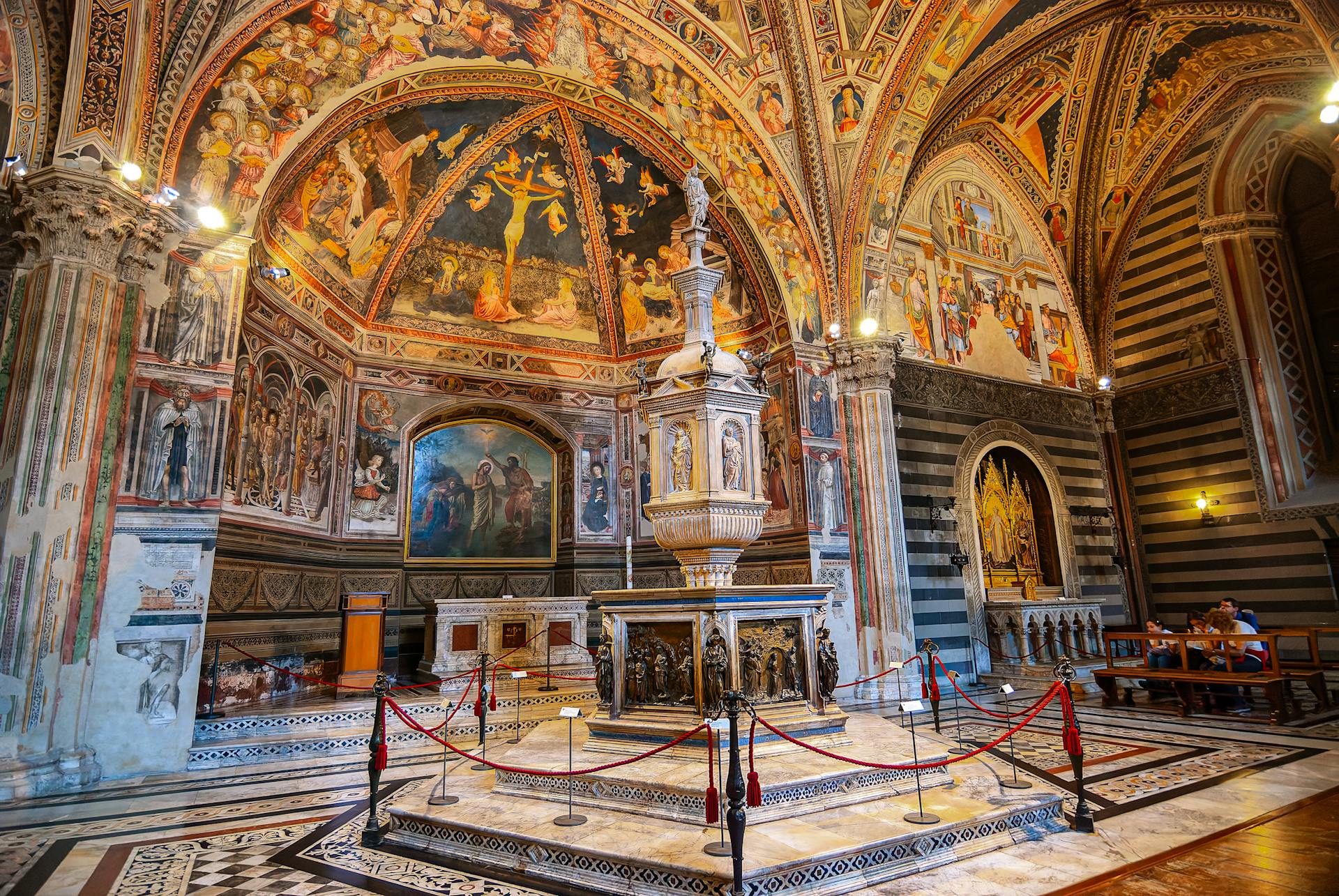 Baptismal Font in Siena Baptistery of San Giovanni in Italy