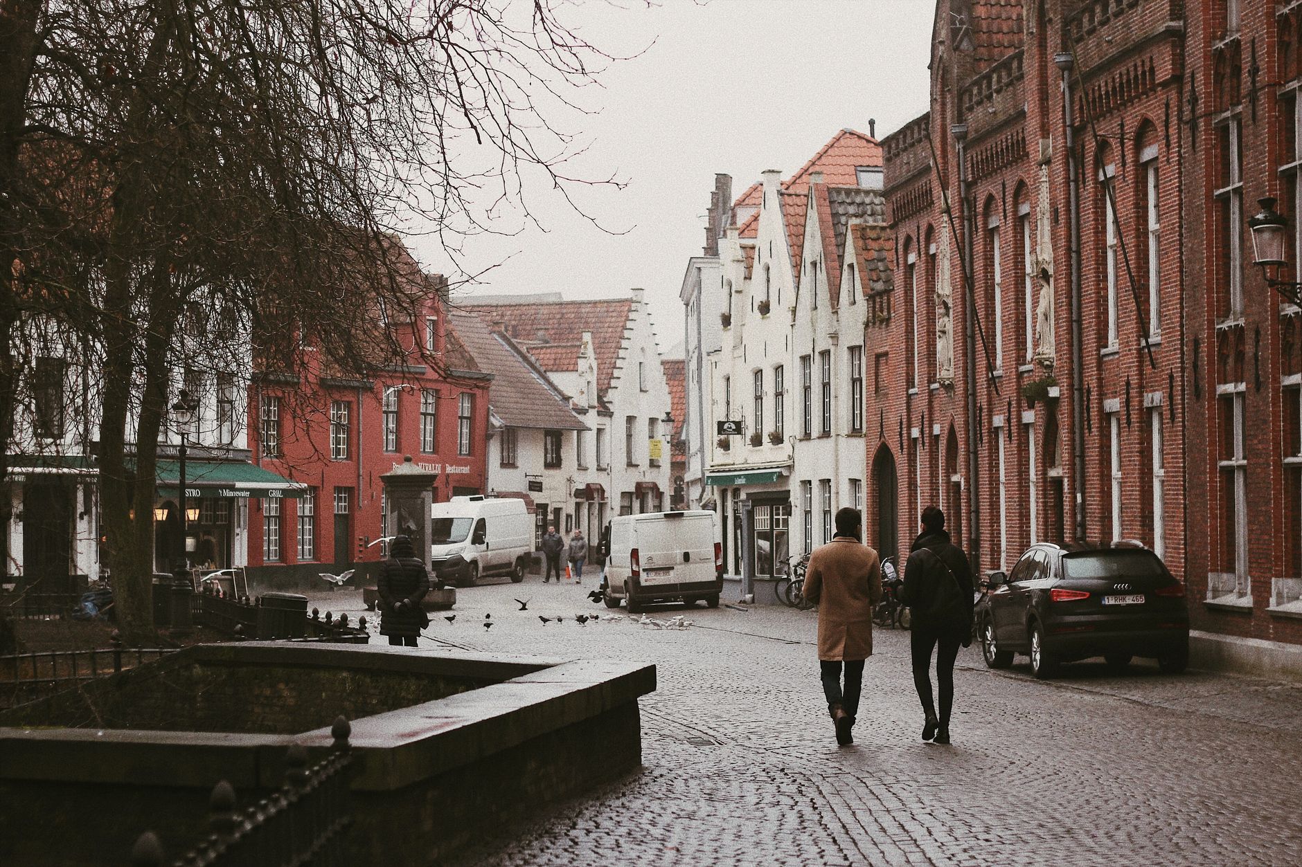 Explore the quaint streets of Bruges with its charming medieval architecture and cobblestone roads.