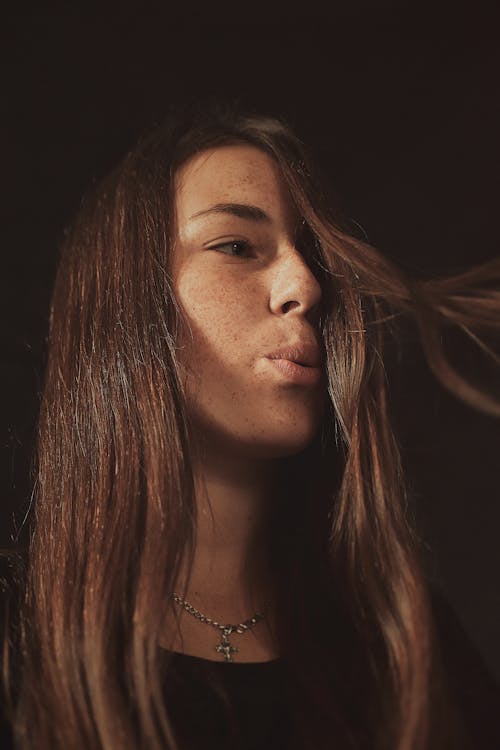 Free Woman Blowing Her Hair Stock Photo