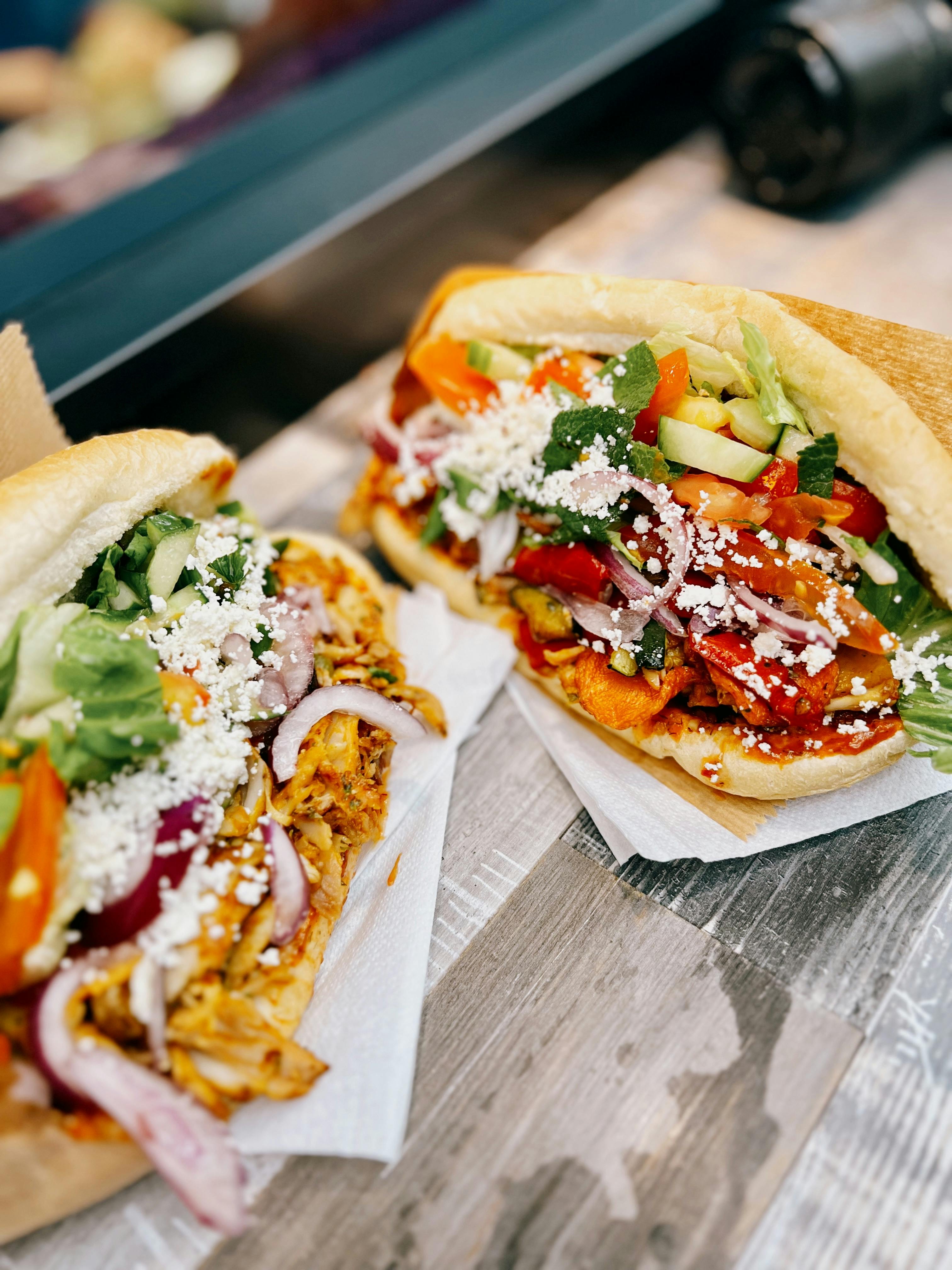 Close-up of vibrant sandwiches with fresh vegetables in a Hamburg cafe, showcasing delicious details.