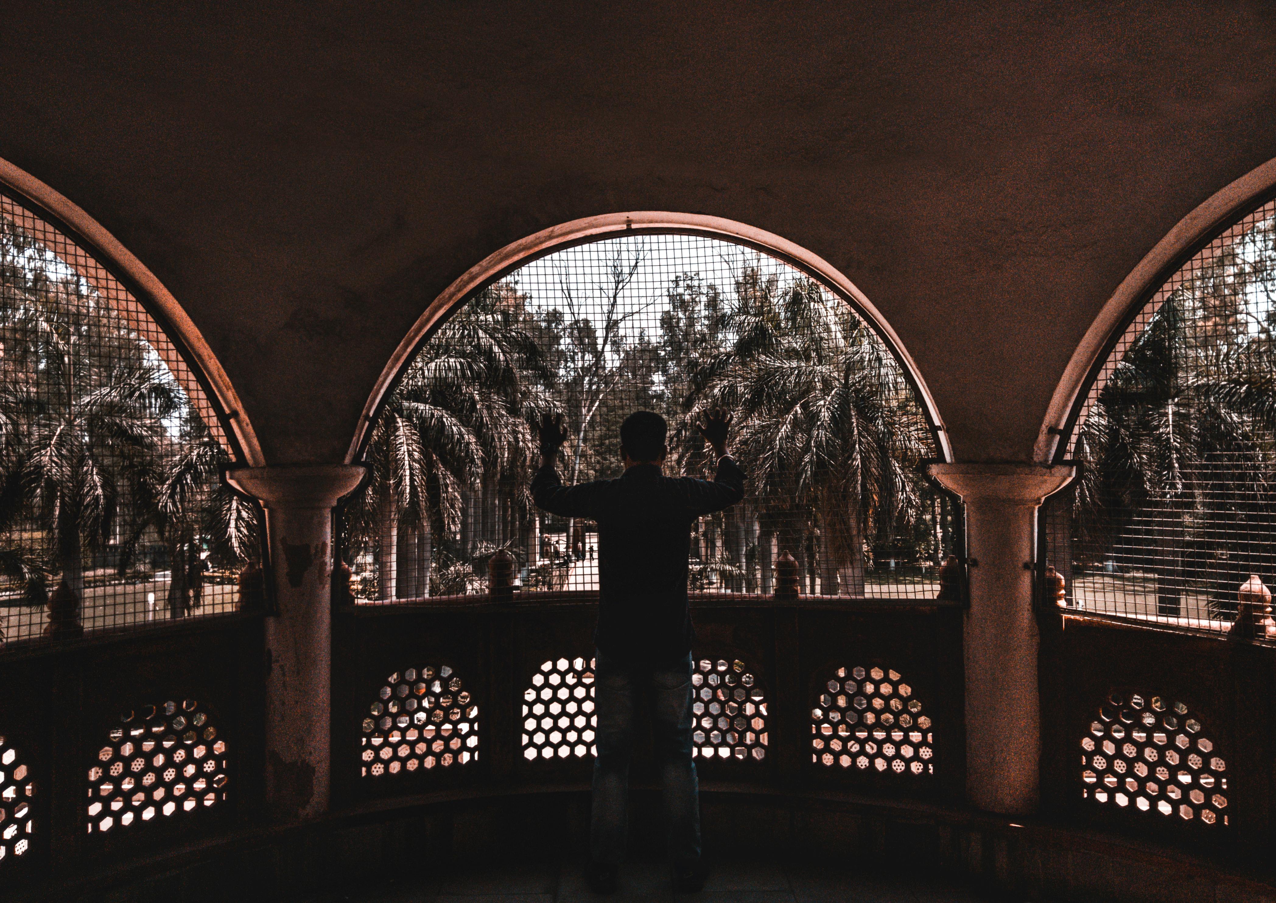 subject framed by architectural elements like an old stone window - composition and framing in photography
