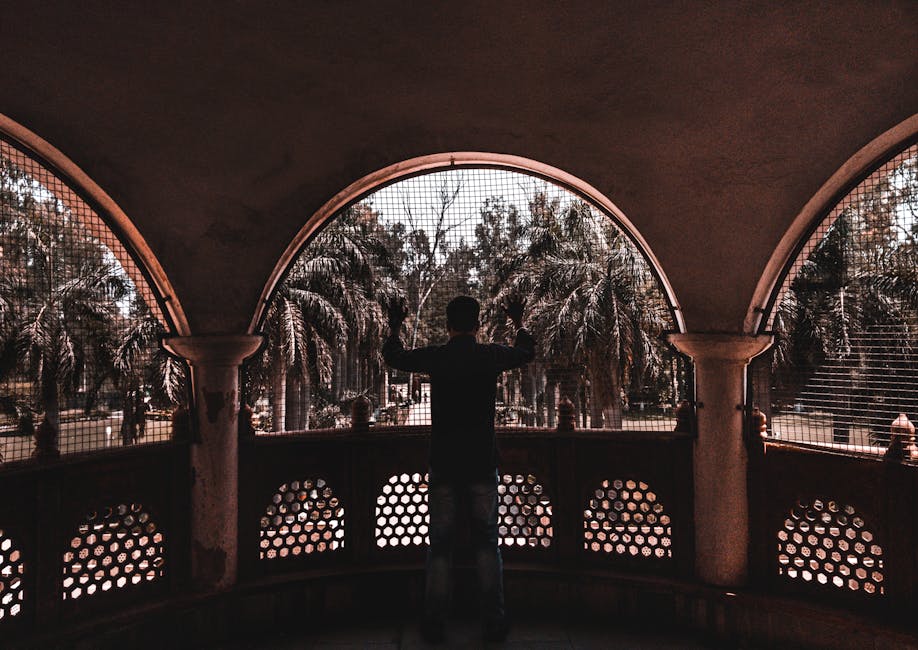 subject framed by architectural elements like an old stone window - composition and framing in photography subject framed by architectural elements like an old stone window - composition and framing in photography