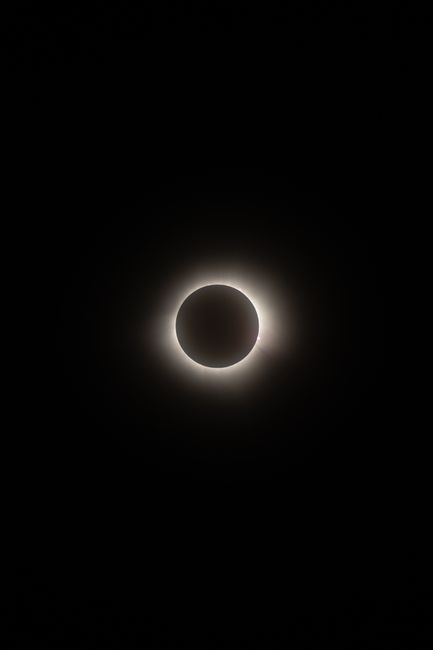 Captivating photo of a solar eclipse highlighting the sun's corona against a dark sky.