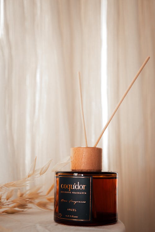 A reed diffuser with a stick in it