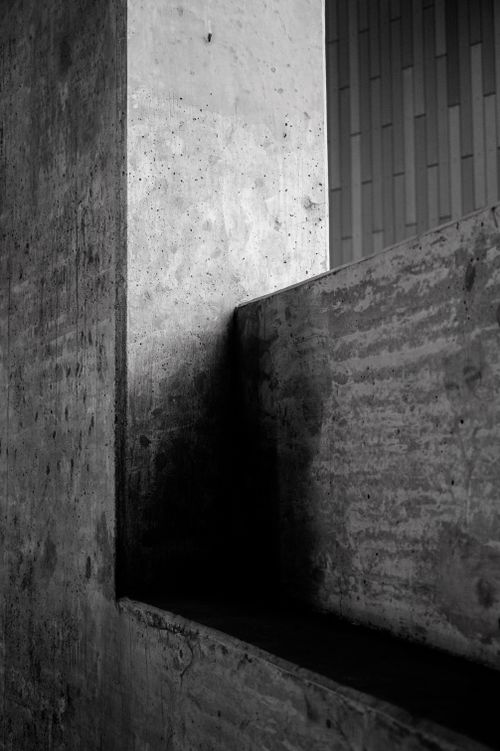 Free Black and white image showing textured concrete walls in an urban environment. Stock Photo