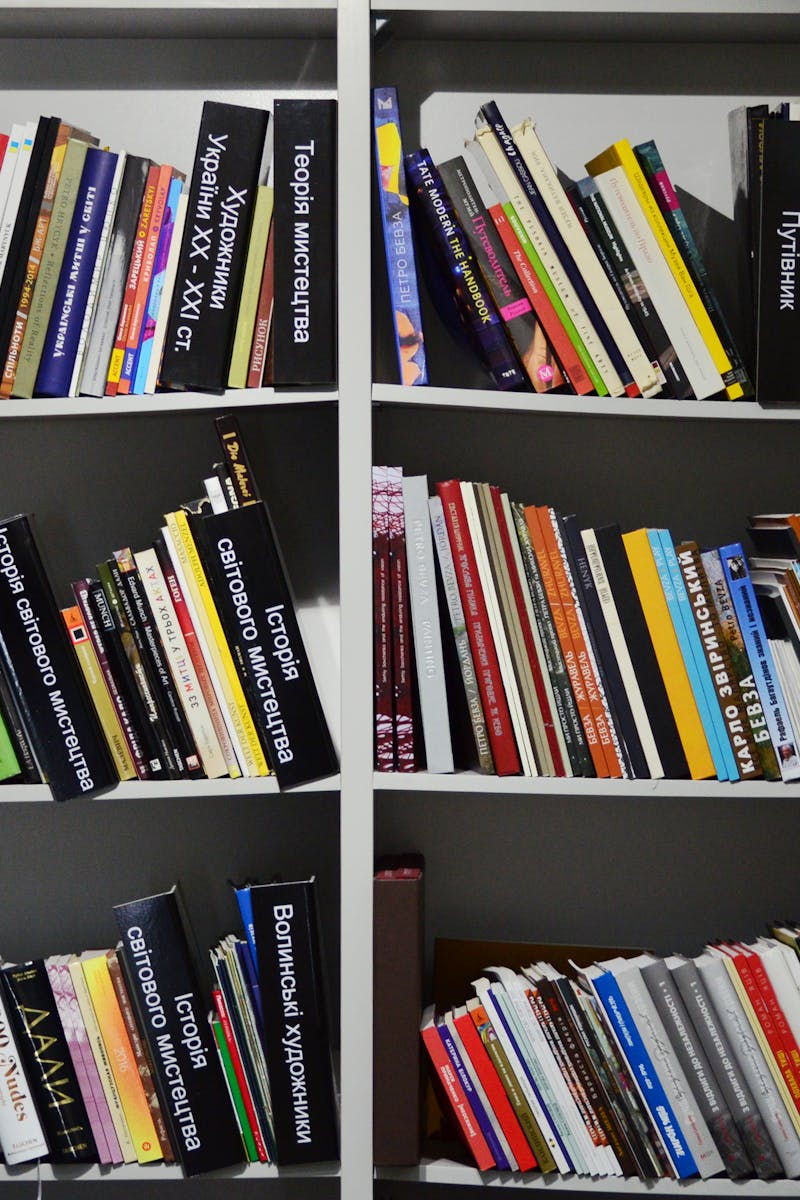 Diverse collection of books on neatly organized shelves in a bookstore setting. Diverse collection of books on neatly organized shelves in a bookstore setting.