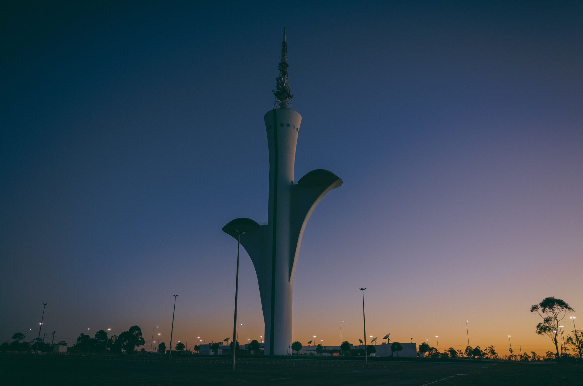 Stunning view of the Brasilia Digital TV Tower during a dramatic sunset in Brasília, Brazil.
