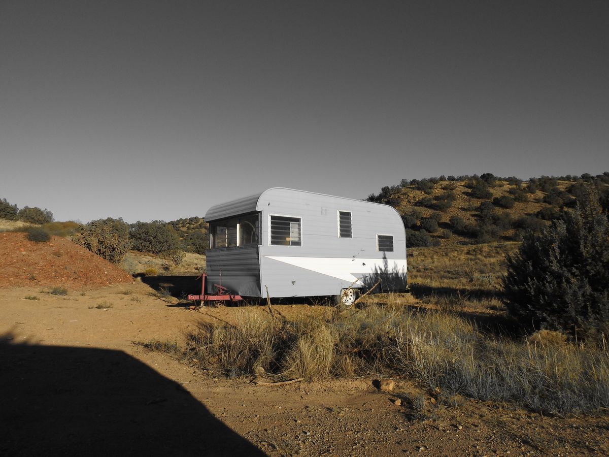 Cirro travel trailer parked on high desert scrub at dusk — photo by Linnea Hansen on Pexels
