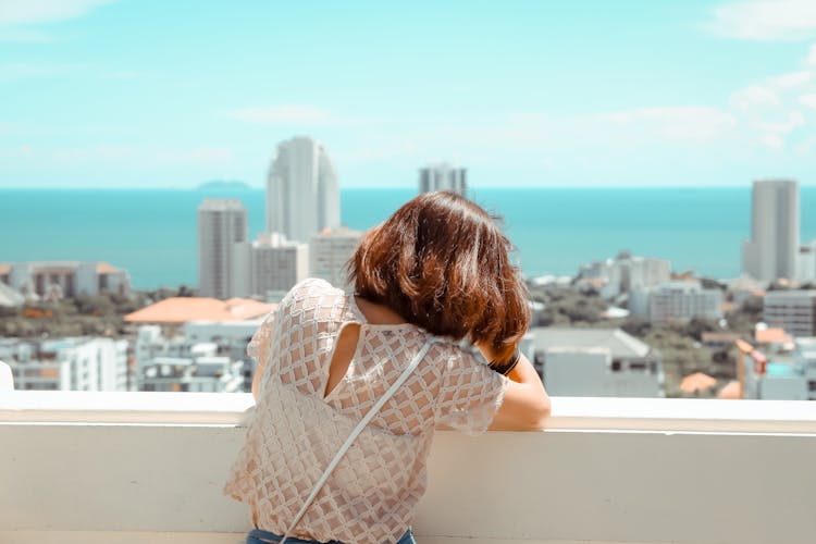 Woman Looking At City