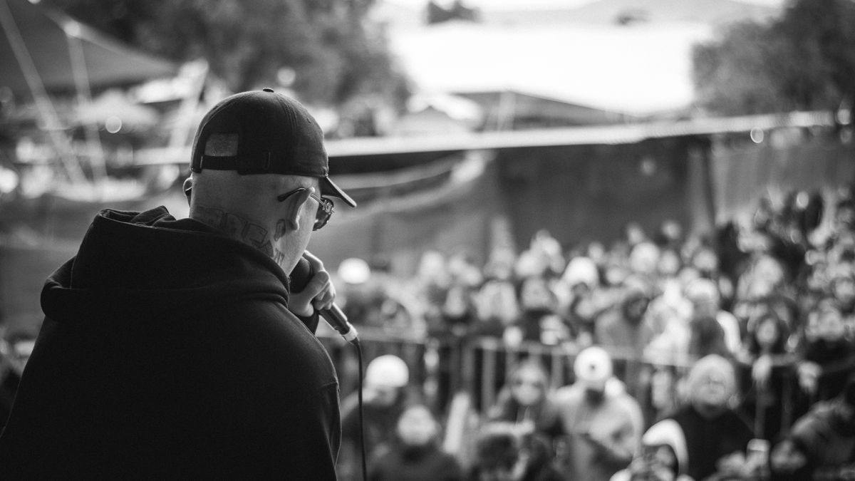 Singer performing live in front of a concert audience