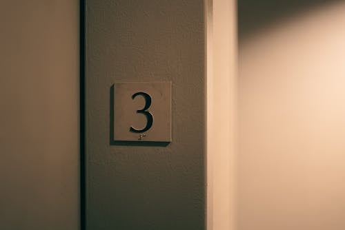 A number three sign on a wall