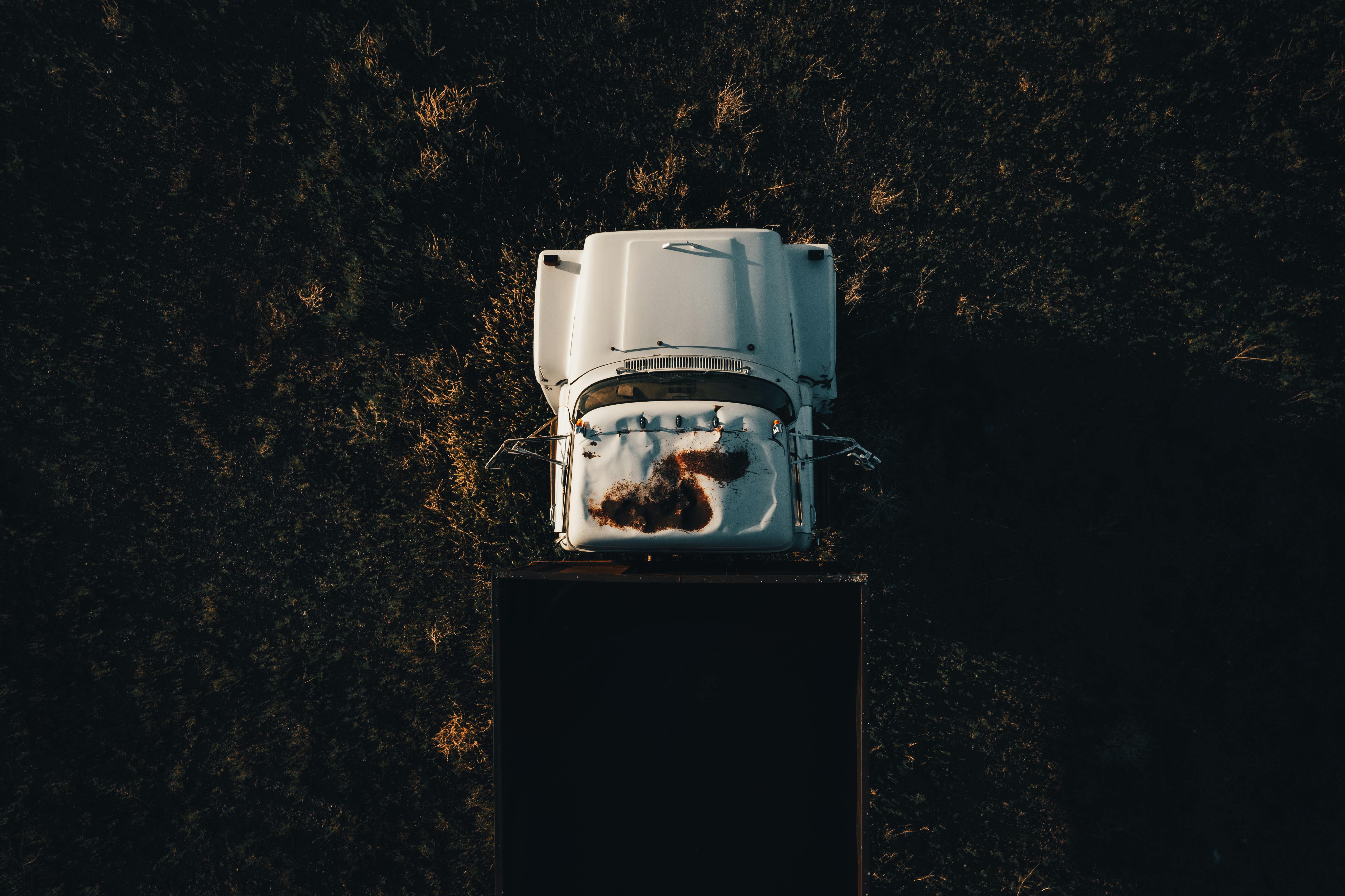 Free Drone shot of an old, rusty truck on a grassy field in Monroe, Utah. Stock Photo