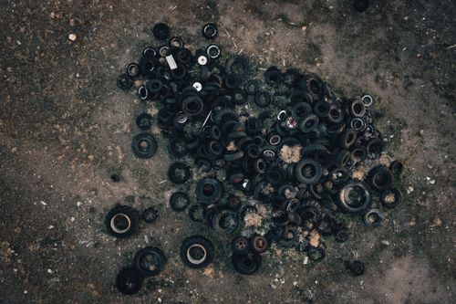 Free Aerial photograph of a large pile of abandoned tires on barren land in Monroe, UT, USA. Stock Photo