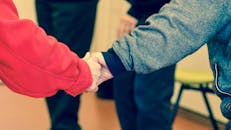 2 Persons Holding Their Hands