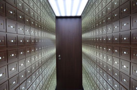 Wooden lockboxes lining the walls of a secure vault