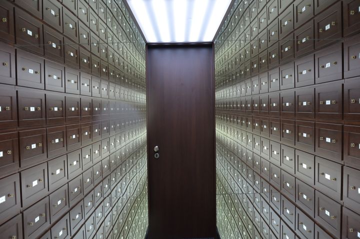 Corridor of lockboxes leading to a secure door