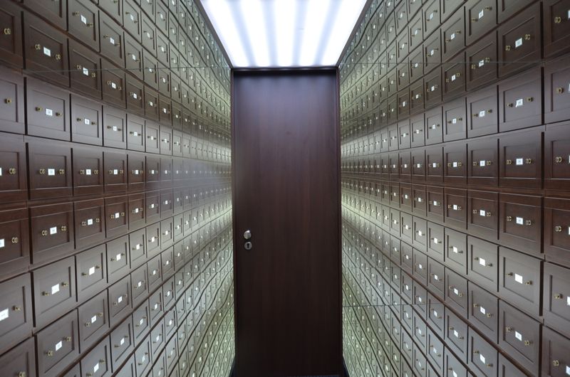 Rows of safe deposit boxes in a vault — photo by Ehtiram Mammadov on Pexels