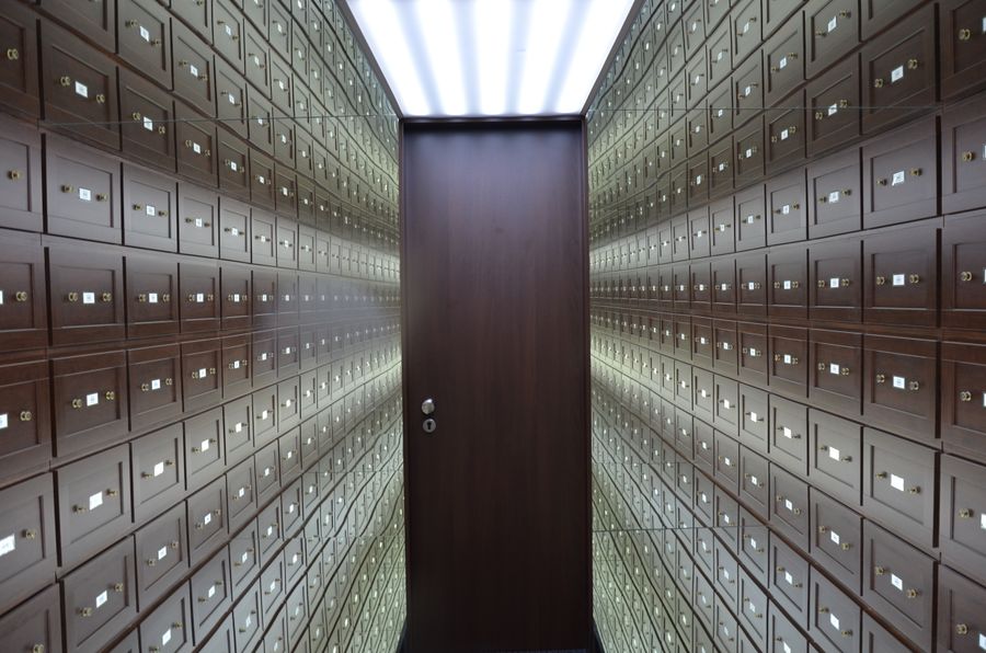 Corridor of lockboxes leading to a secure door
