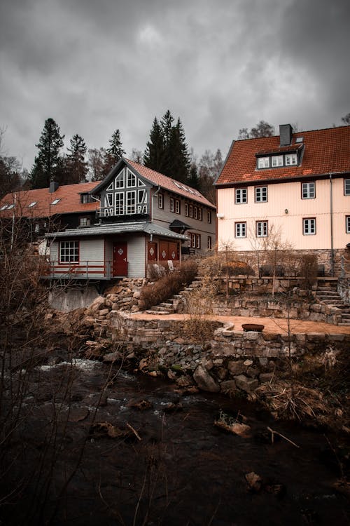 A house is next to a river and a stream