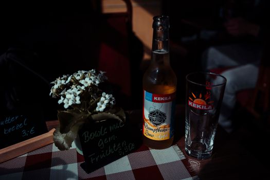 Beer Bottle and Glass on Table