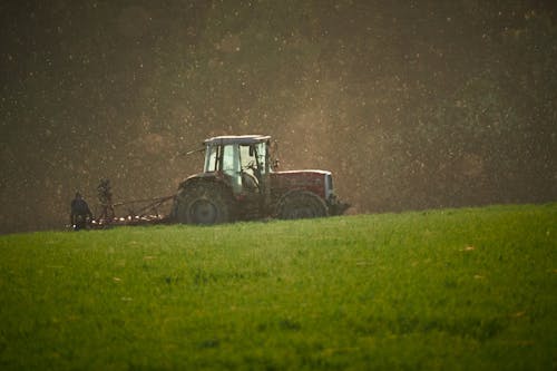Free A Tractor In The Field Stock Photo