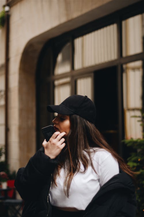 Woman Wearing Black Cap