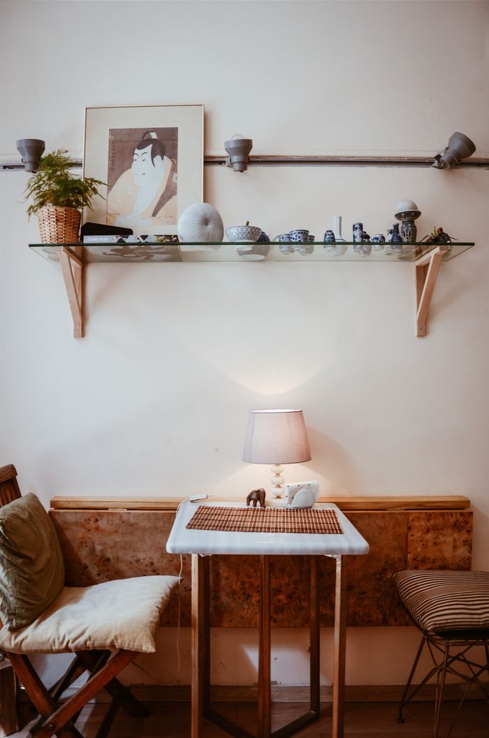 Simple cozy living room with wooden furniture and warm lighting