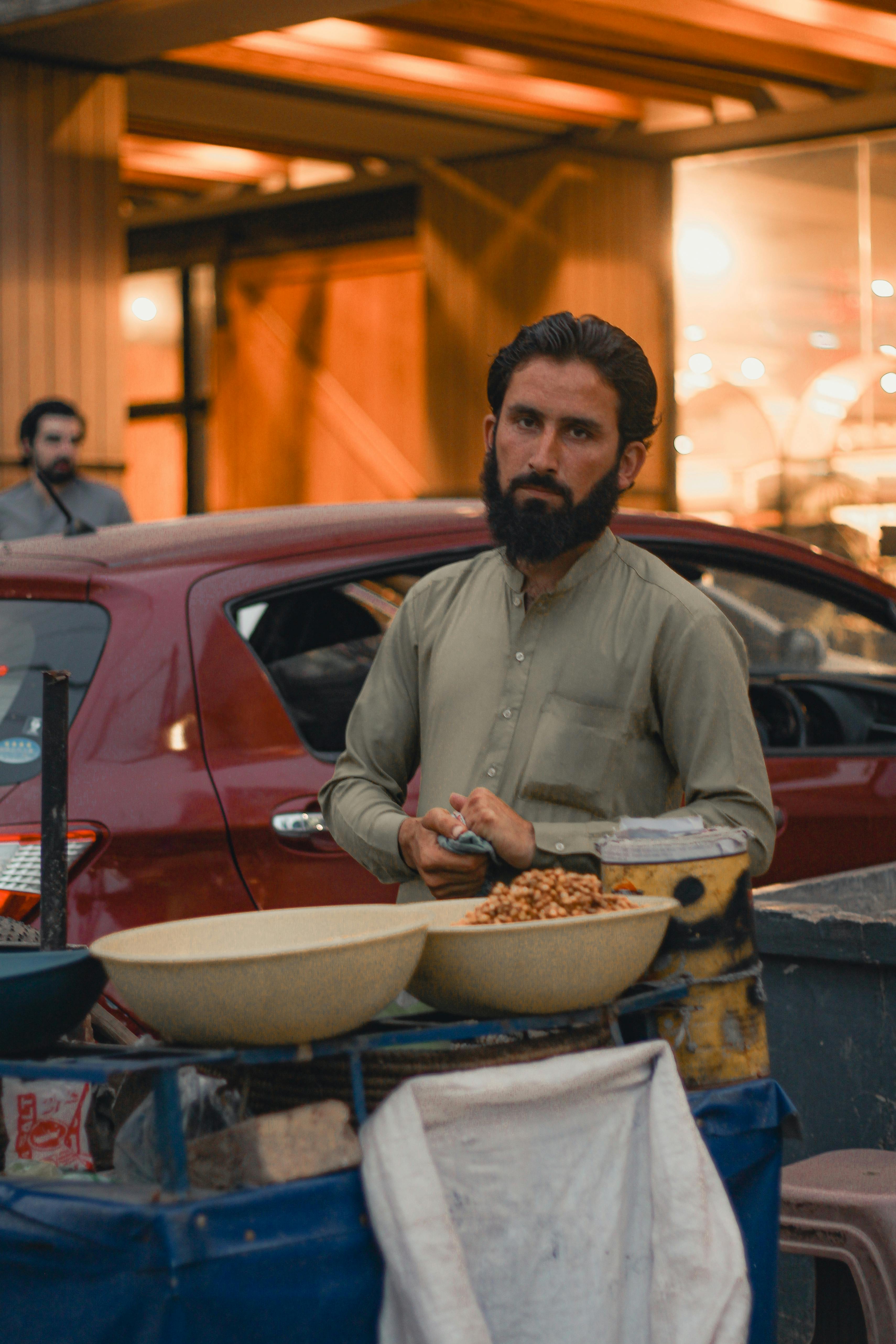 man standing at a bazzar in afghanistan