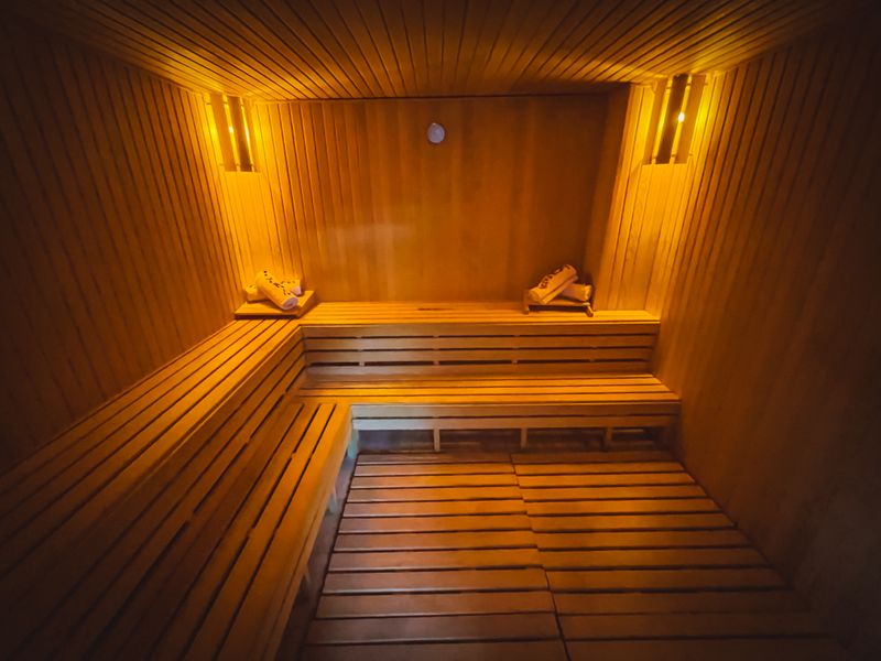 Cozy wooden sauna interior with warm ambient lighting