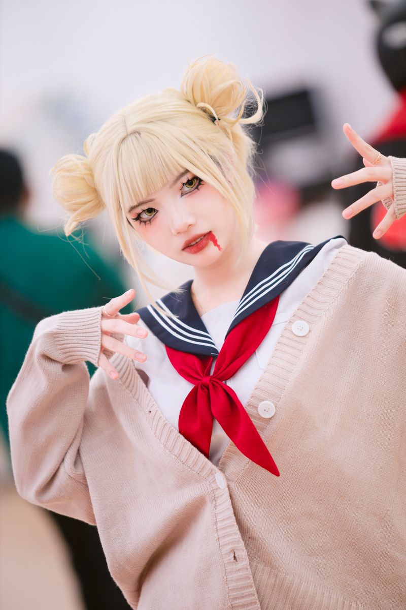 A woman cosplaying Himiko Toga from My Hero Academia with a playful pose in a detailed costume.