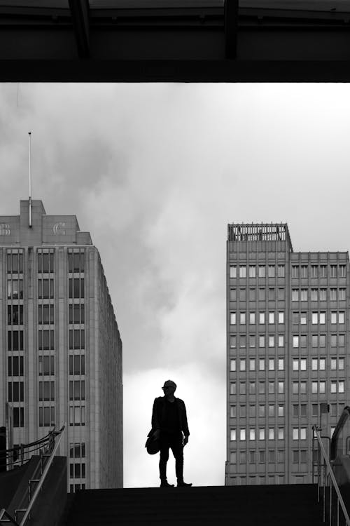 A Man Standing on Top of the Stairs City 