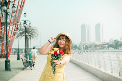 Woman Holding Bouquet of Flowers