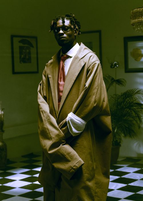 Free A fashionable musician poses indoors with a vintage style in a Lagos studio. Stock Photo