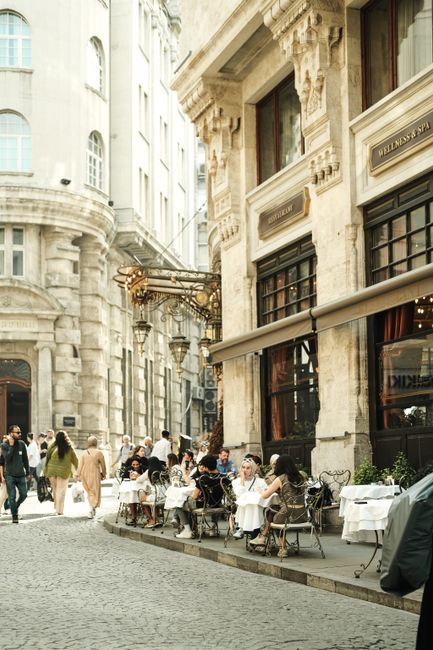 Outdoor cafe scene in Istanbul with people enjoying the historic city streets.