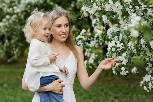 Free Woman Carrying Female Child Stock Photo