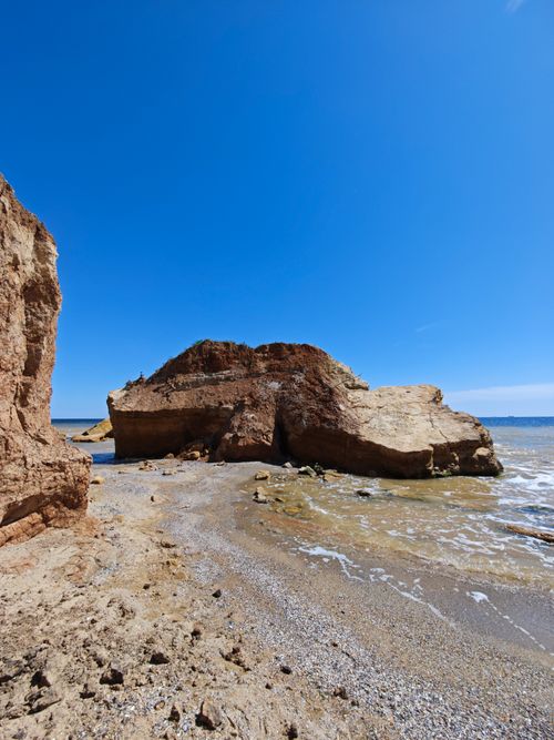 Free Explore the rugged beauty of eroded cliffs on a sunny Odessa beach day. Stock Photo