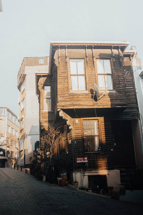 A house is on a cobblestone street