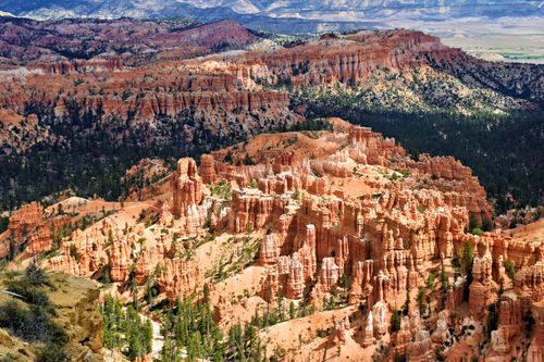 Free Stunning aerial view of Bryce Canyon's unique red rock formations under a clear blue sky. Stock Photo