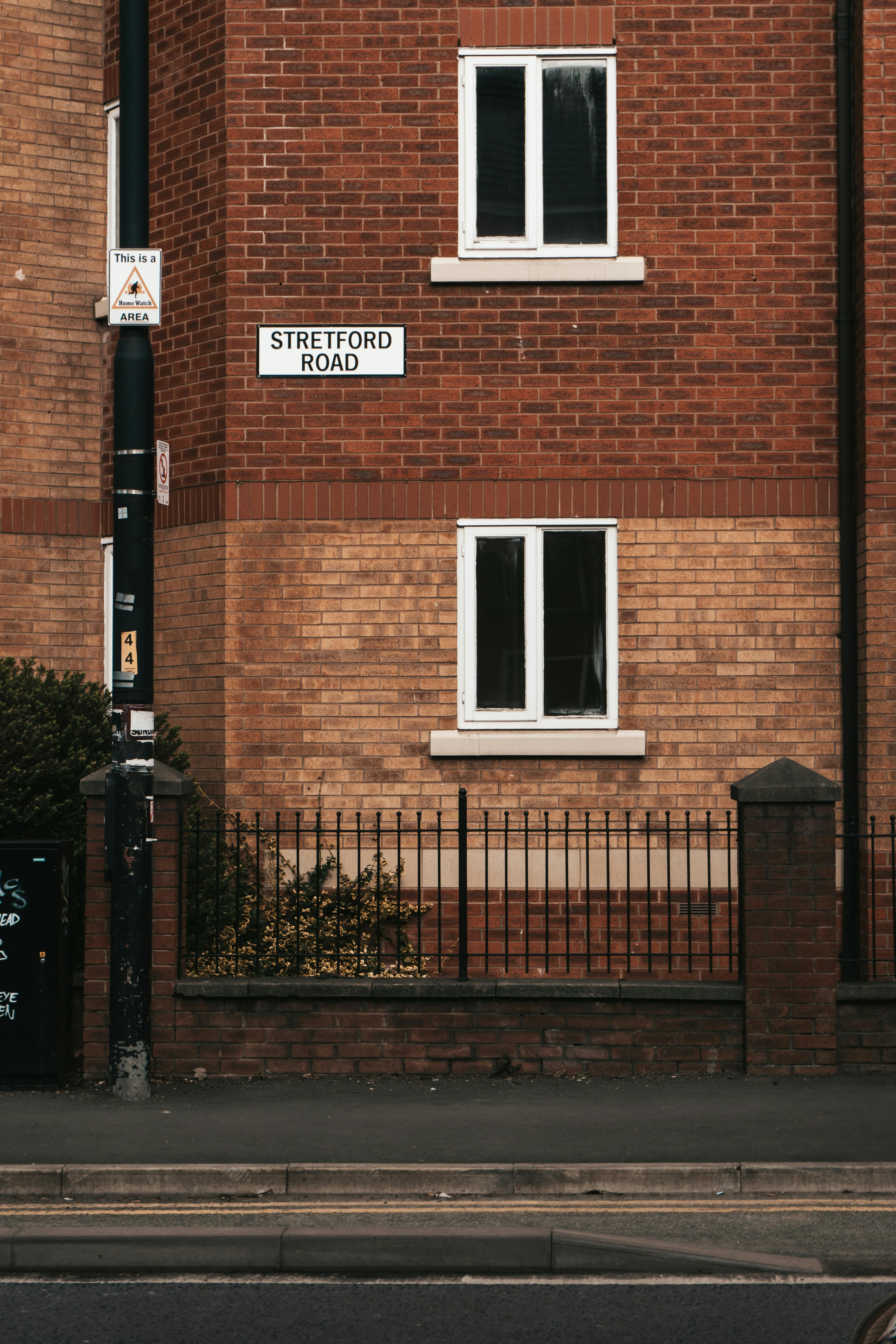 Free Brick facade of a building on Stretford Road in Manchester, showcasing classic urban architecture. Stock Photo