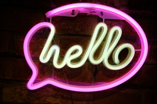 Neon sign with the word hello on it