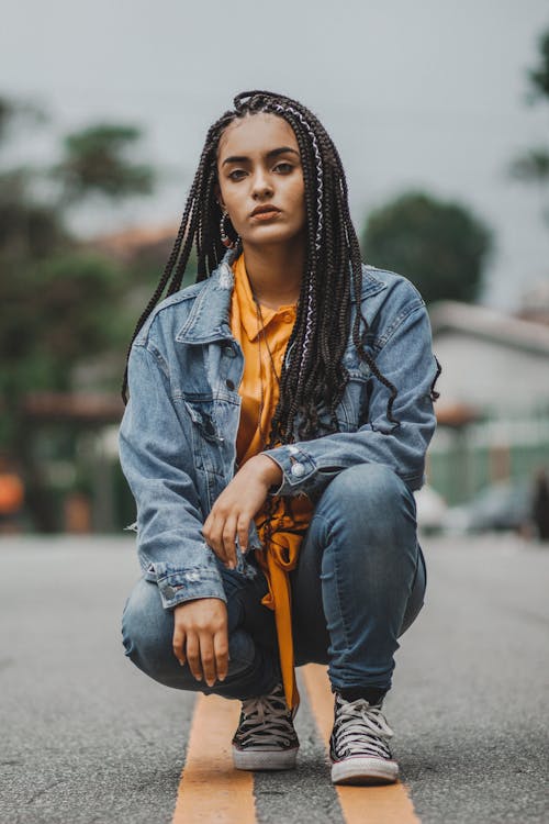 Free Photo of Woman Squat Posing in The MIddle of the Road Stock Photo