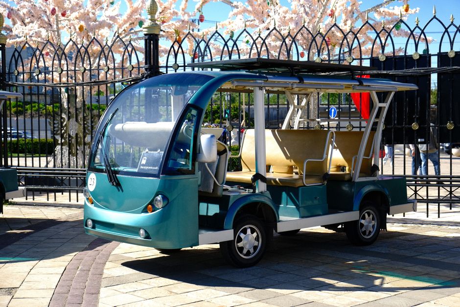 modern shuttle vehicle parked near a terminal - ta services