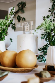 Elegant Korean first birthday table with decor and traditional white cake.