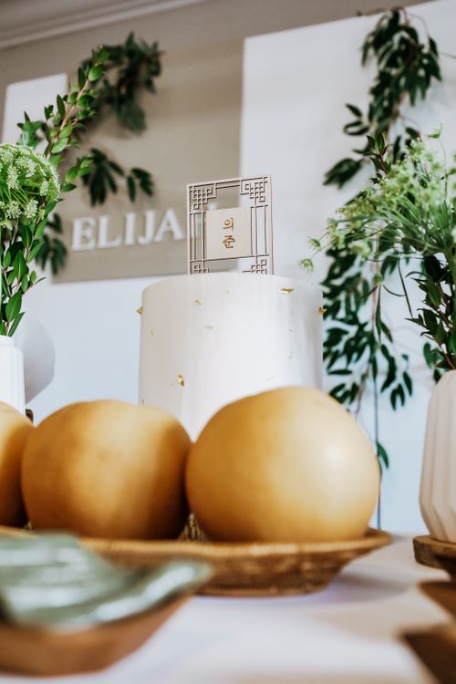 Free A beautifully decorated white cake with pears and greenery, perfect for a sophisticated event. Stock Photo